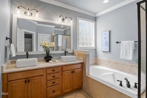 a bathroom with a double vanity sink and a mirror