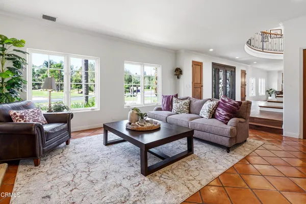 a kitchen with granite countertop lots of stainless steel appliances wooden cabinets and a counter top space