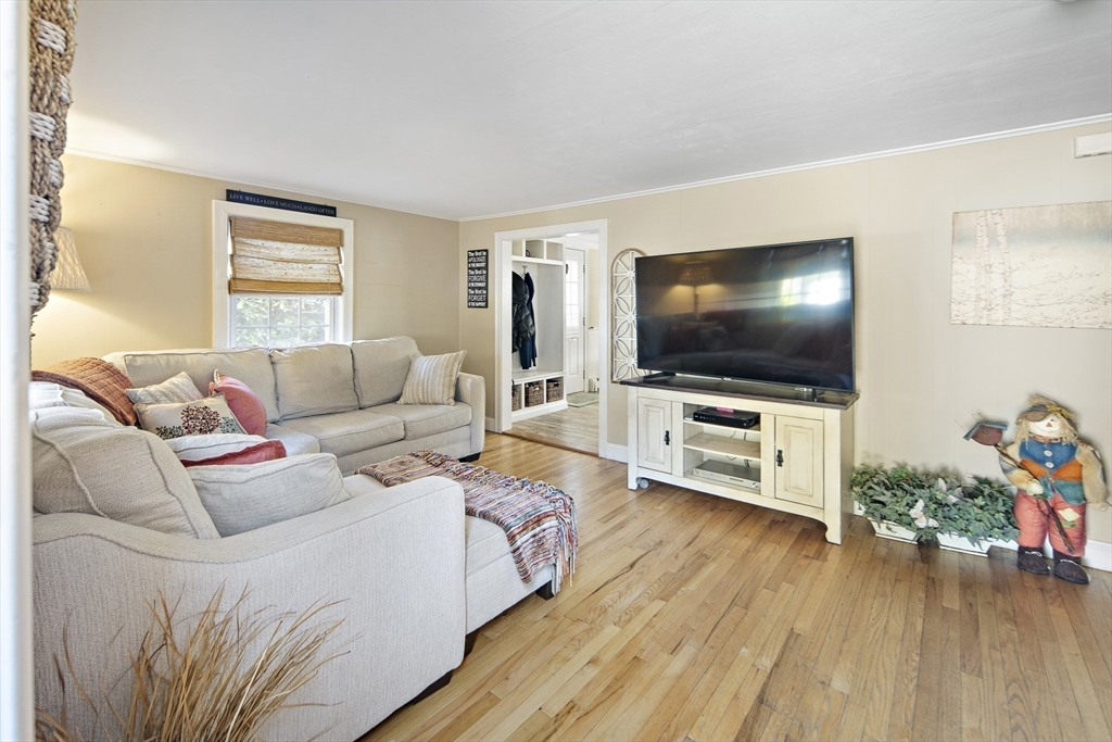 38 Sutcliffe Avenue Canton, MA 02021 - Photo 12 of 29 a living room with furniture and a flat screen tv