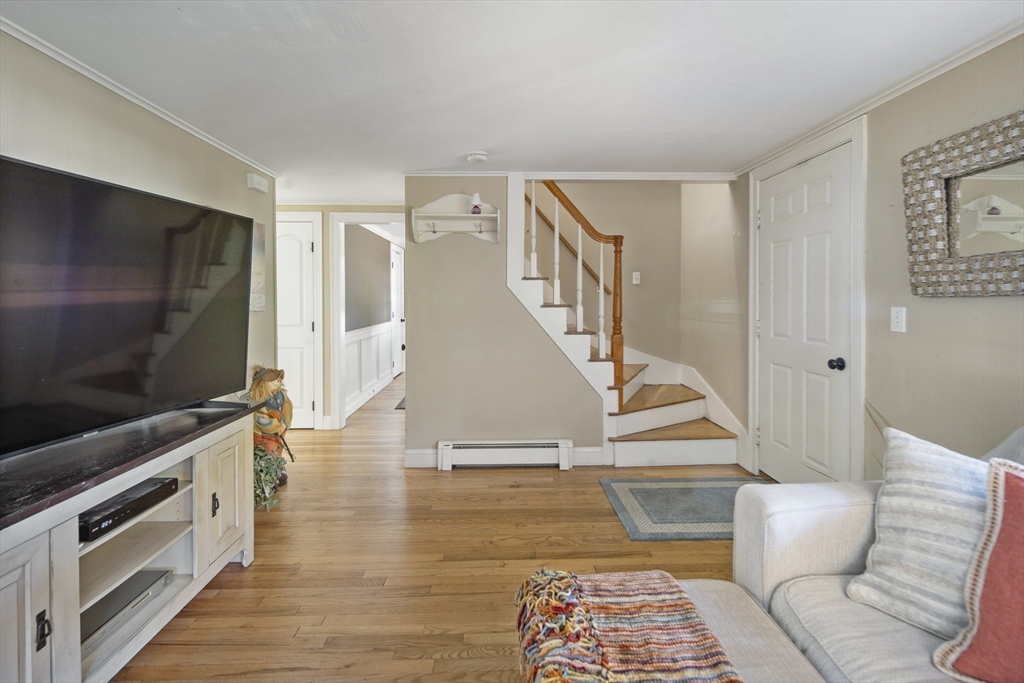 38 Sutcliffe Avenue Canton, MA 02021 - Photo 20 of 29 a living room with a flat screen tv and a rug