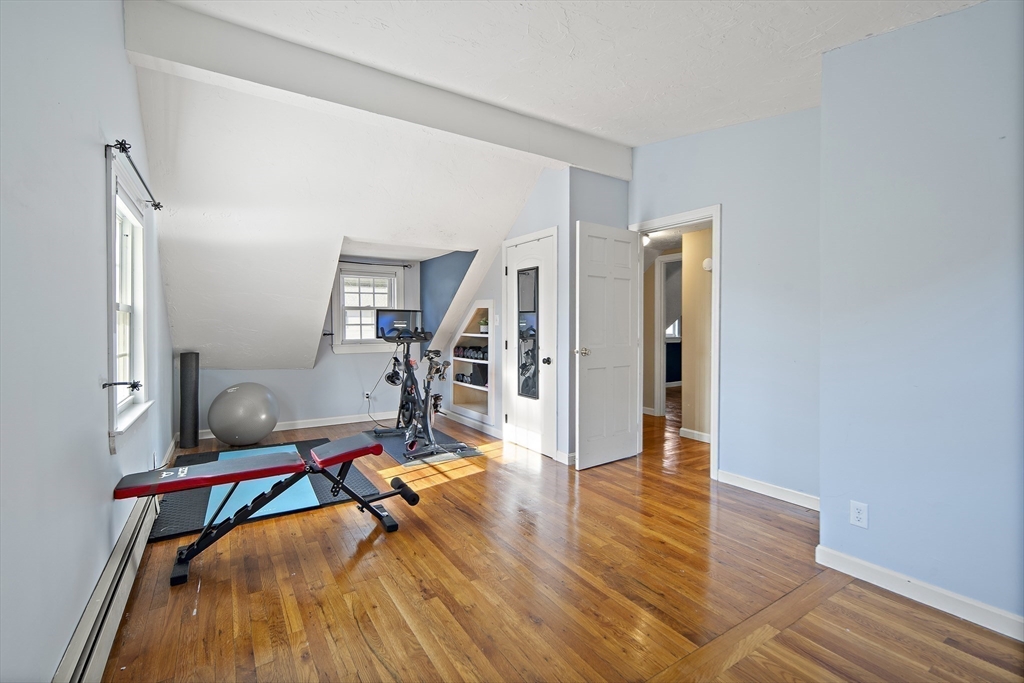 38 Sutcliffe Avenue Canton, MA 02021 - Photo 24 of 29 a view of a room with wooden floor and furniture