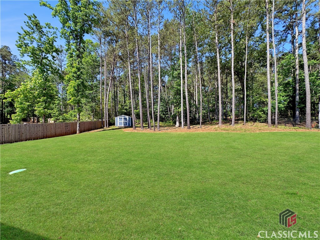 87 Evergreen Ridge Court Statham, GA 30666 - Photo 10 of 36 Level backyard to play and enjoy your pet!
