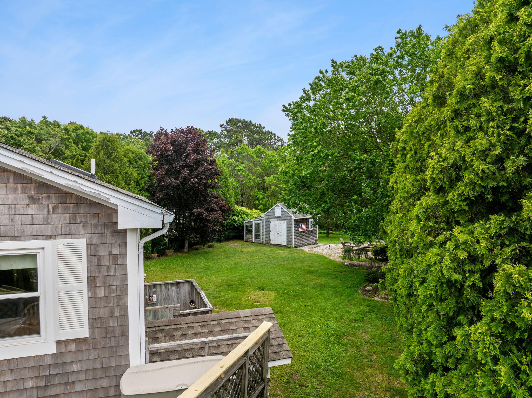 8 Stackpole Circle Bourne, MA 02532 - Photo 10 of 51 a view of a backyard with couches plants and large tree