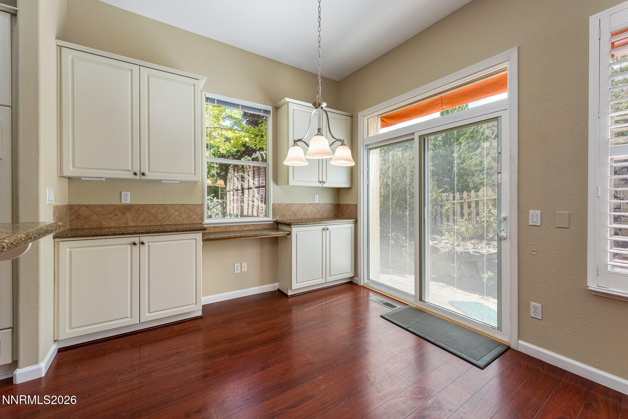 1840 Hunter Creek Road Reno, NV 89519 - Photo 8 of 39 a kitchen with granite countertop wooden floors and wide window