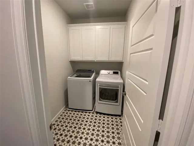 a bathroom with a sink toilet and window