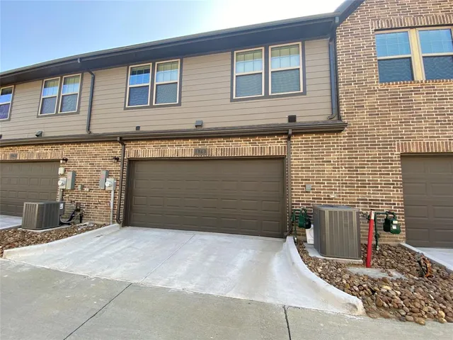 a front view of a house with garage