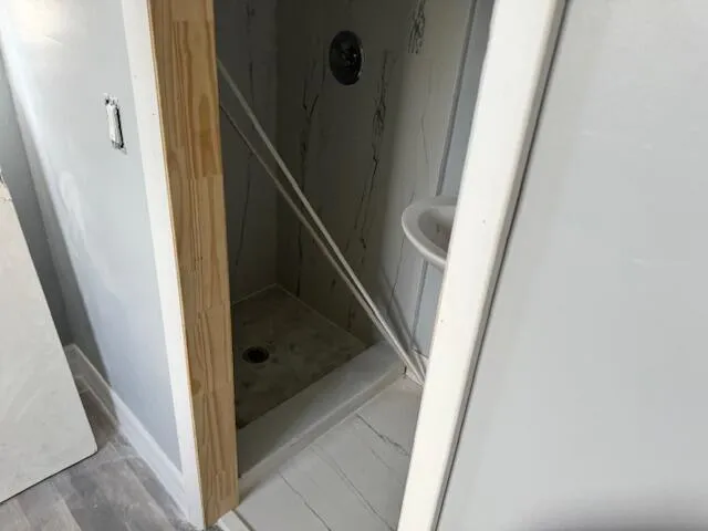a bathroom with a tub and a sink
