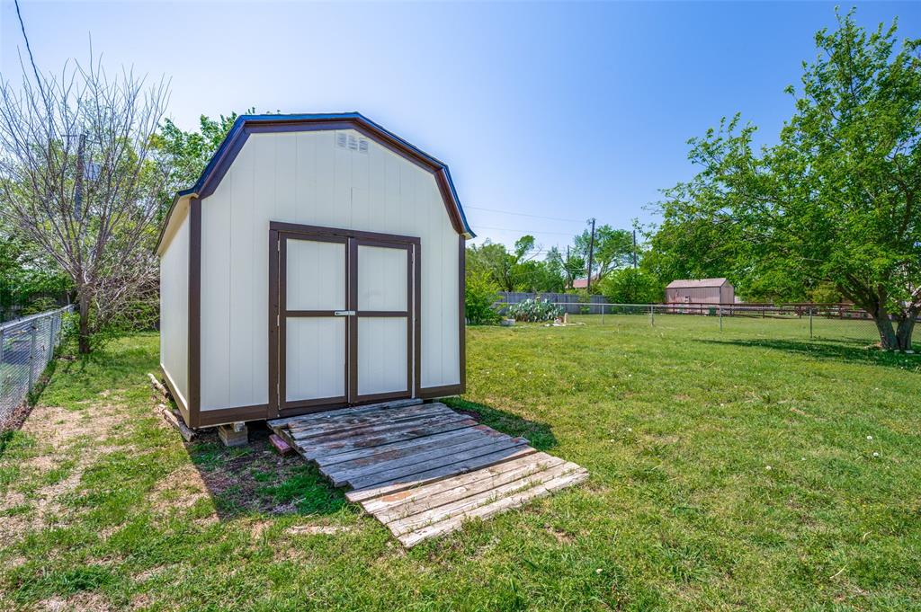 629 Concho Drive Oak Point, TX 75068 - Photo 30 of 35 a view of a backyard with a garden