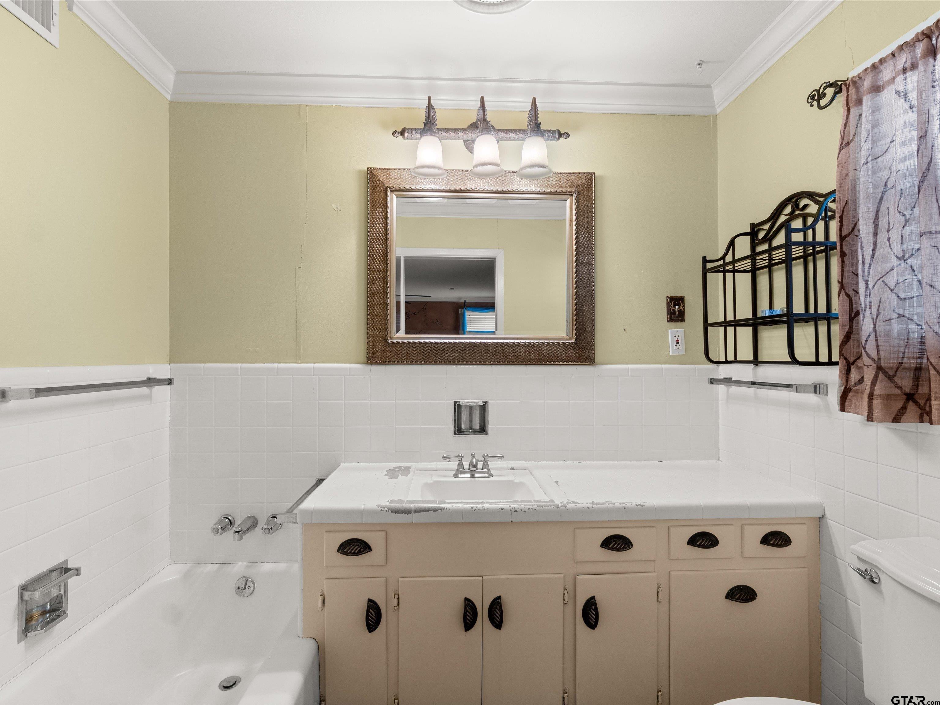 6 Lindsey Lane Longview, TX 75601 - Photo 27 of 33 a bathroom with a sink and a mirror