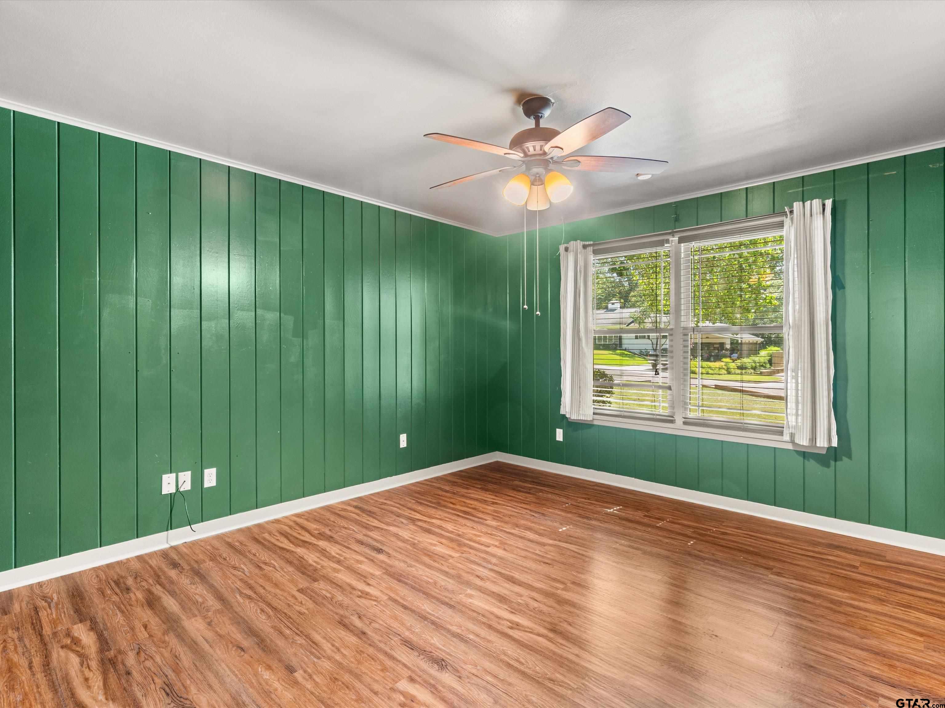 6 Lindsey Lane Longview, TX 75601 - Photo 29 of 33 a view of a big room with windows and a chandelier fan