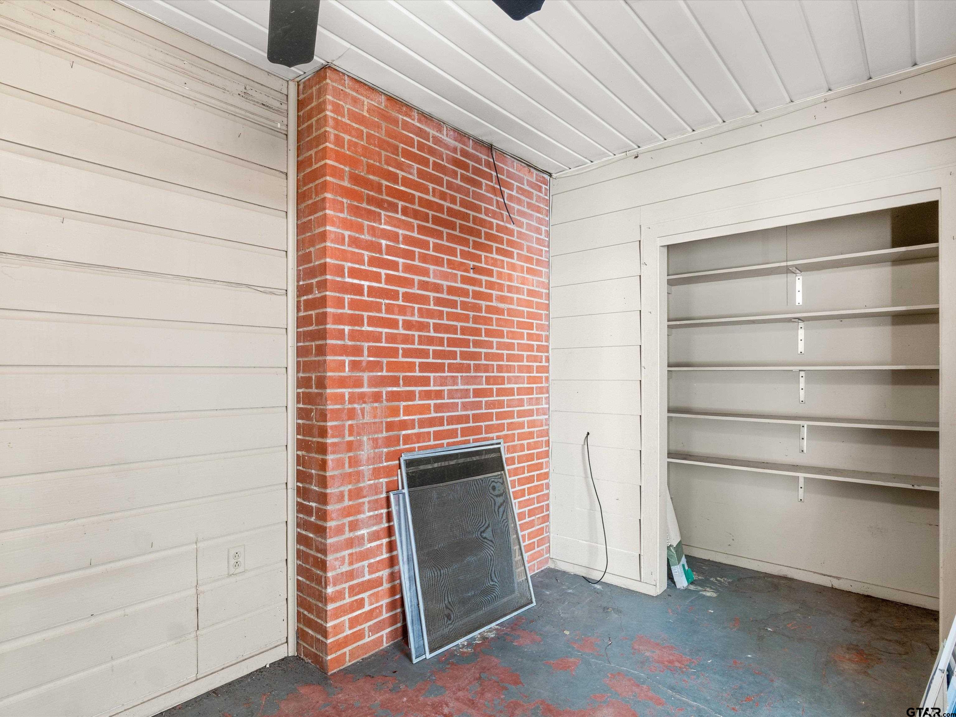 6 Lindsey Lane Longview, TX 75601 - Photo 32 of 33 a view of empty room with a fireplace and wooden floor
