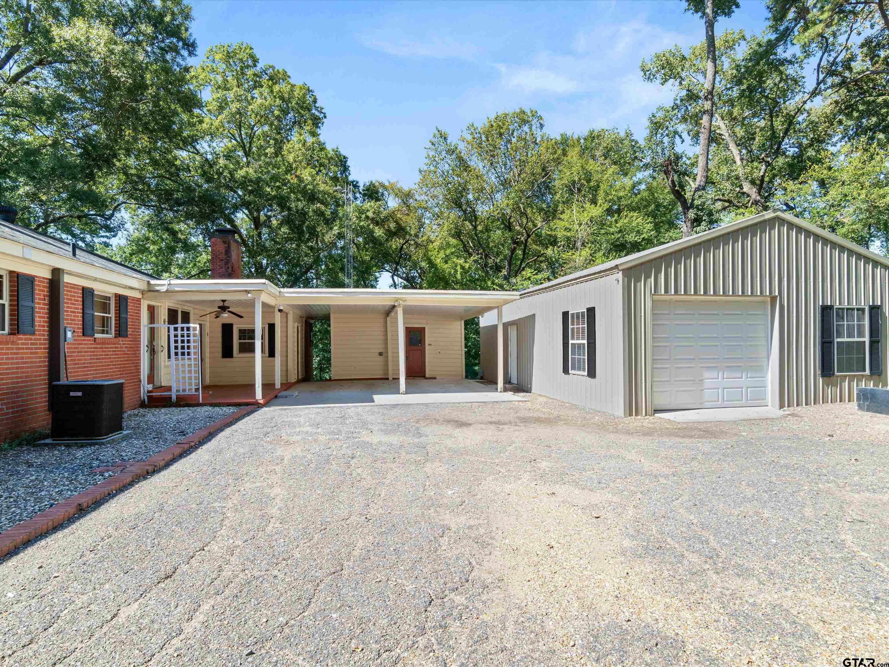 6 Lindsey Lane Longview, TX 75601 - Photo 10 of 33 a front view of a house with a garden