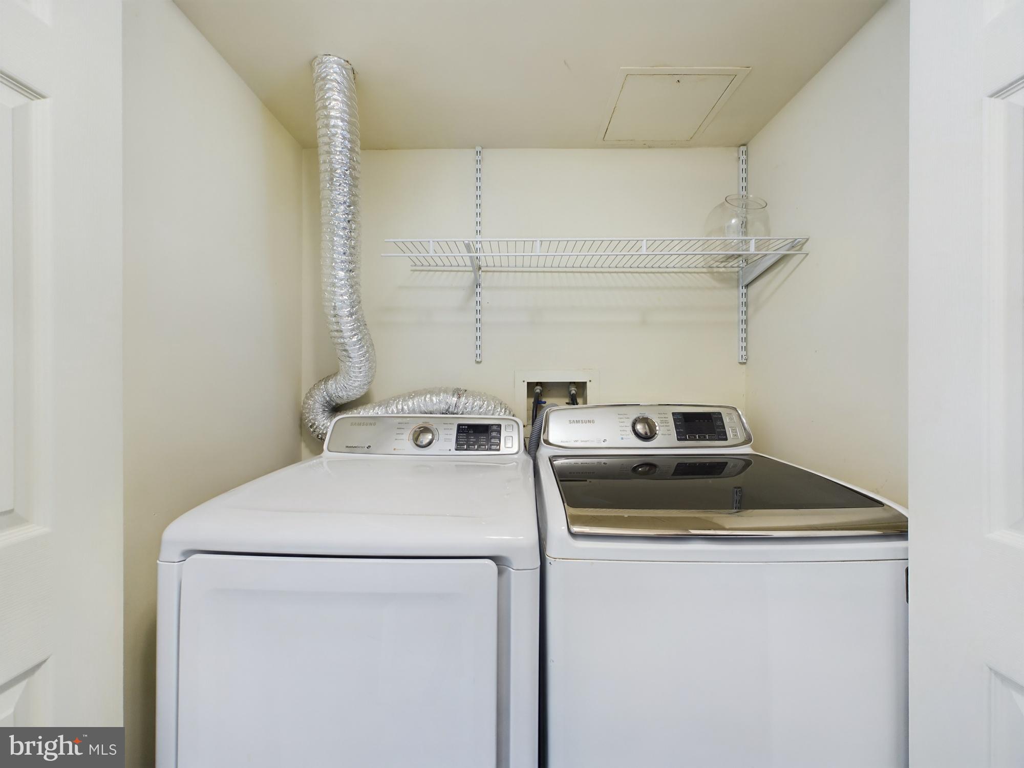 11566 Rolling Green Court, Unit 101 Reston, VA 20191 - Photo 25 of 38 a utility room with dryer and washer