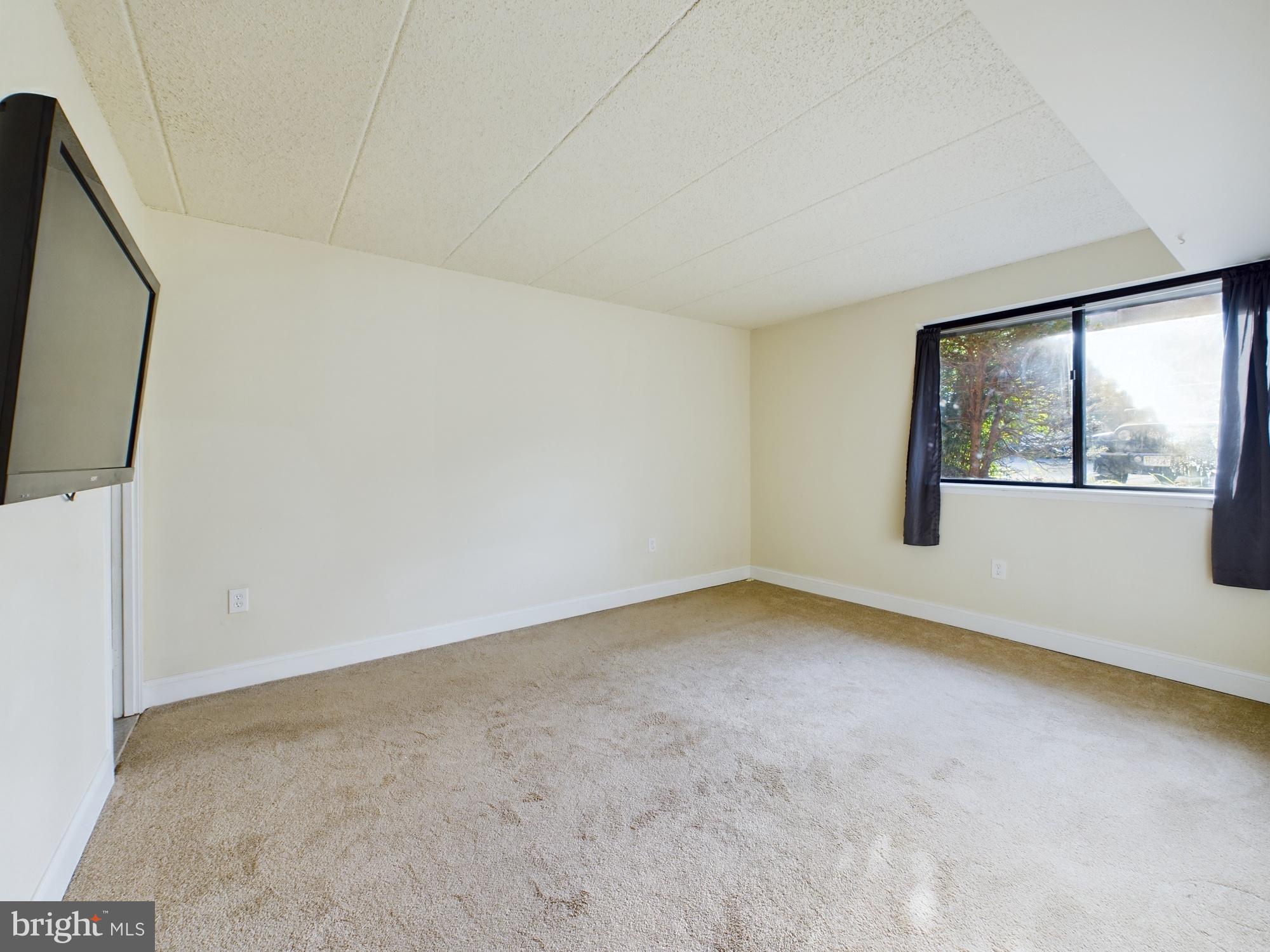 11566 Rolling Green Court, Unit 101 Reston, VA 20191 - Photo 31 of 38 a view of empty room with window