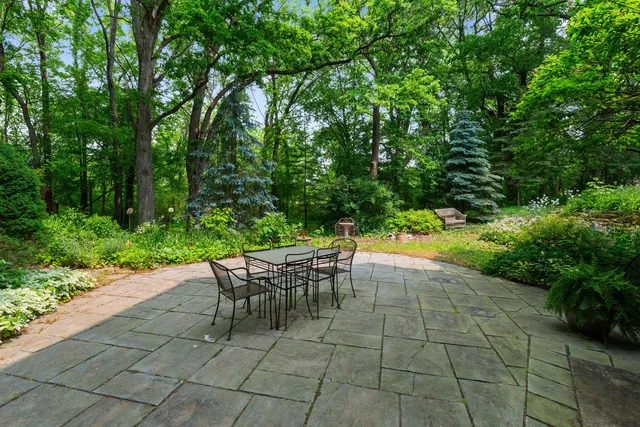 a view of a backyard with sitting area