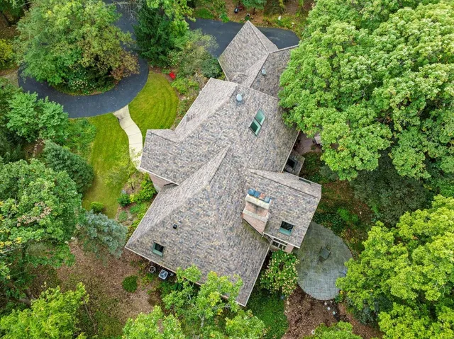 an aerial view of a house with outdoor space