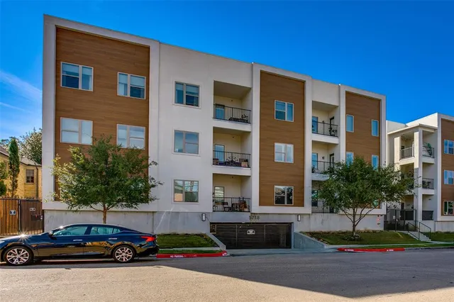 a cars parked in front of a brick building