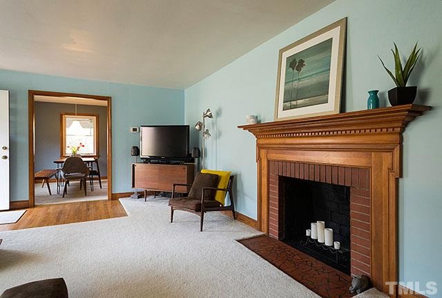 2701 Winton Road Durham, NC 27707 - Photo 6 of 25 Wood-burning fireplace in living room.