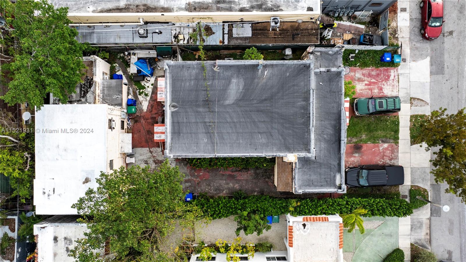 1721 Southwest 12th Street Miami, FL 33135 - Photo 5 of 8 an aerial view of a house with a yard and potted plants