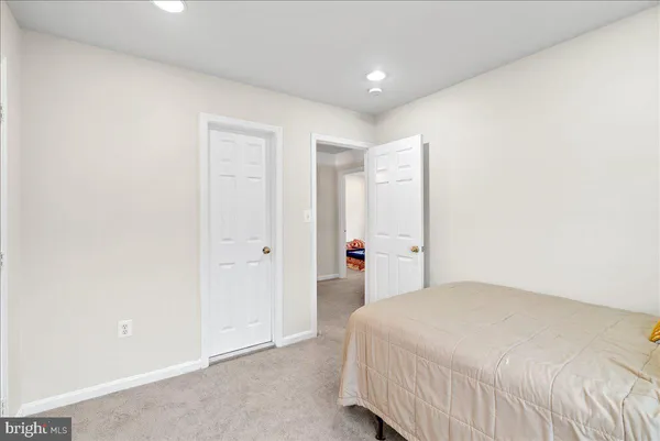 a bedroom with a bed and a closet