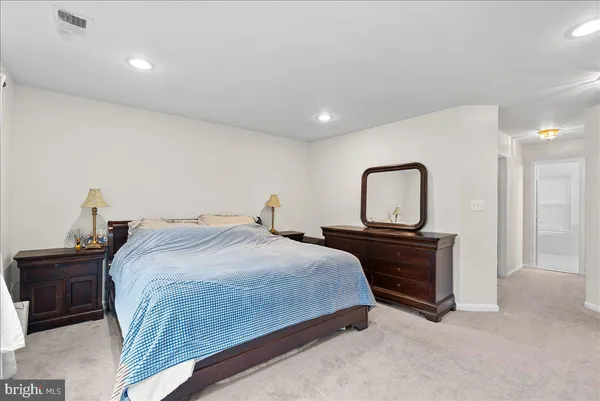 a bedroom with a bed and with furniture