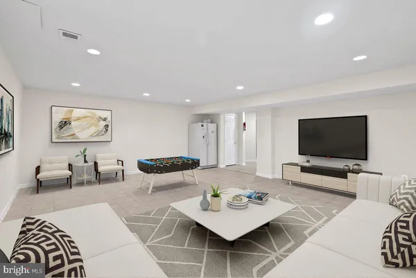 an empty room with white walls and tiles