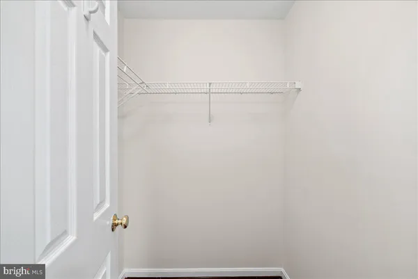 a bathroom with a sink toilet and a mirror