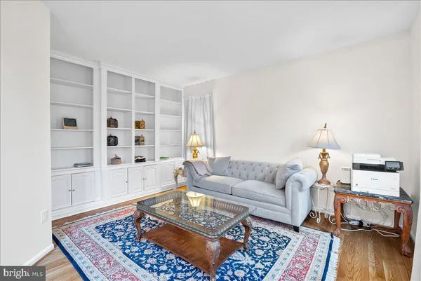 a living room with furniture and a rug