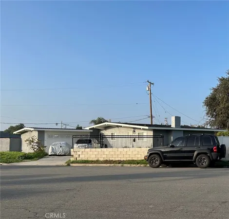a view of a car parked in front of a house