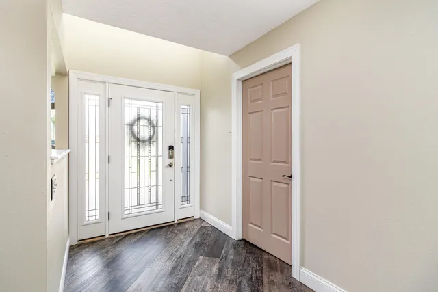 an empty room with wooden floor