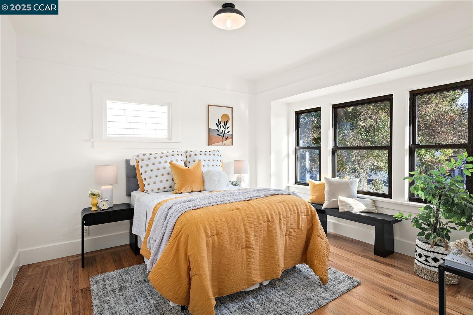 1233 Haskell Street Berkeley, CA 94702 - Photo 11 of 24 a bed room with a bed and a window