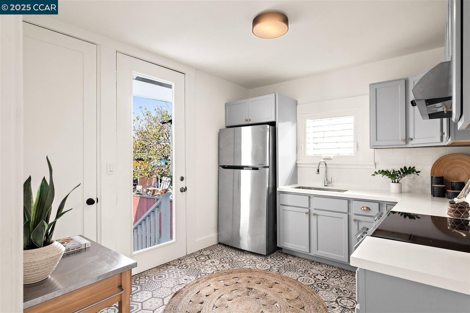 1233 Haskell Street Berkeley, CA 94702 - Photo 16 of 24 a kitchen with a refrigerator and a sink