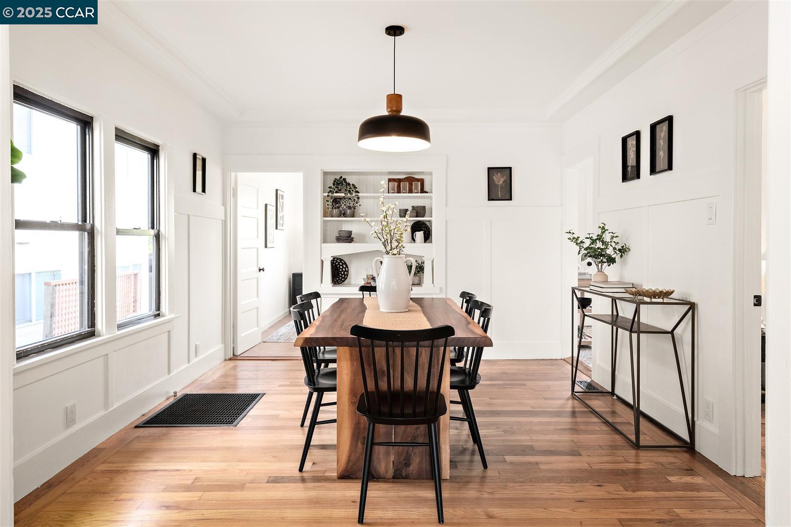 1233 Haskell Street Berkeley, CA 94702 - Photo 9 of 24 a dining room with furniture window and wooden floor