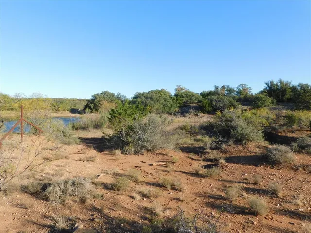 a view of a lake with houses in the back
