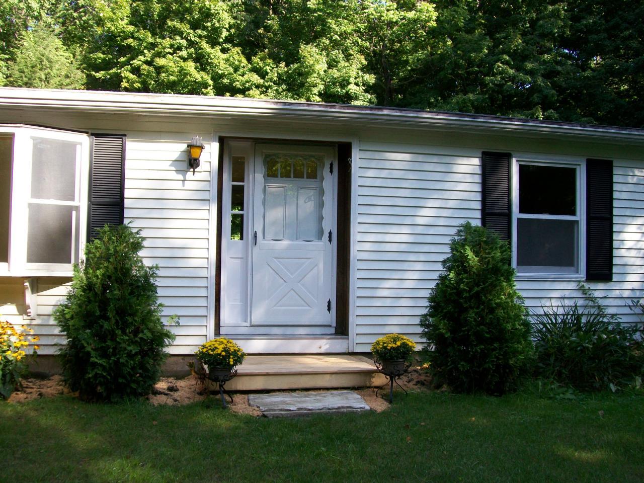 2017 Swamp Road Richmond, MA 01254 - Photo 12 of 16 a front view of a house with a garden