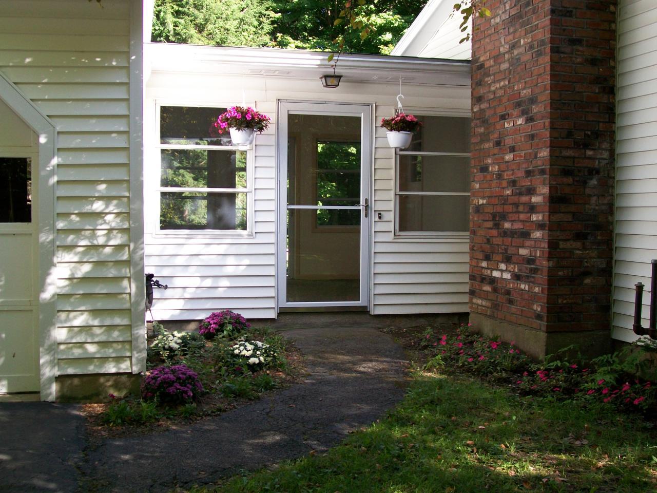 2017 Swamp Road Richmond, MA 01254 - Photo 14 of 16 a front view of a house with plants