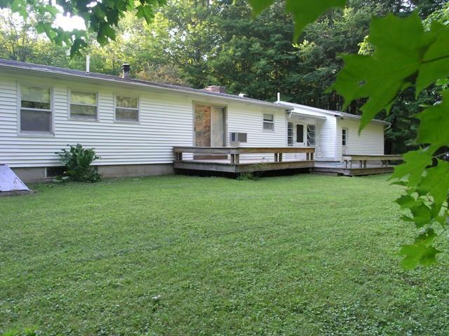 2017 Swamp Road Richmond, MA 01254 - Photo 3 of 16 a view of a white house with a big yard potted plants and large tree