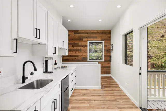 a kitchen with sink and window