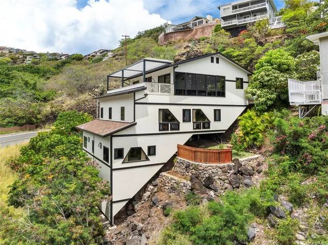 an aerial view of a house with a yard