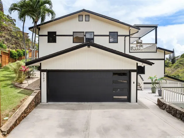 a front view of a house with a garage