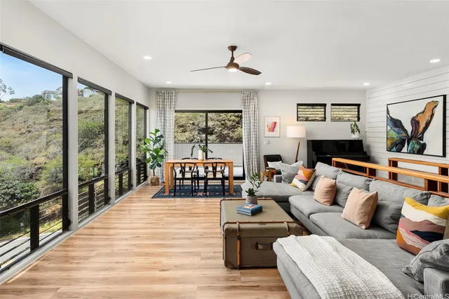 a living room with furniture and a large window