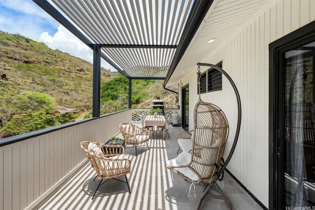 a view of balcony with furniture