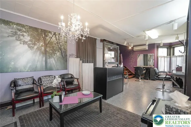 a view of a balcony with furniture and floor to ceiling window