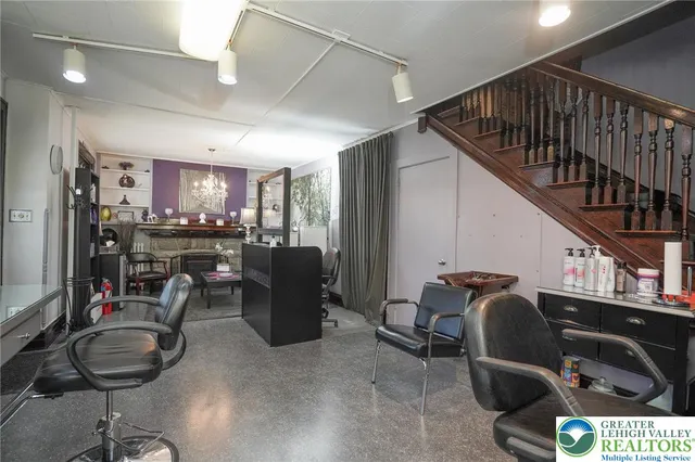 a kitchen with granite countertop a sink and a wooden floor