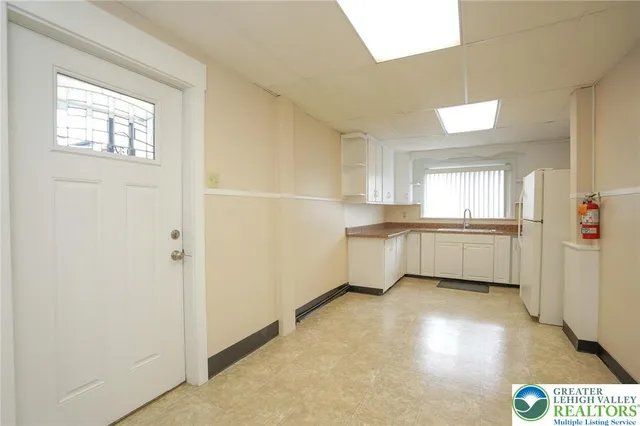 a view of a livingroom with wooden floor and a window
