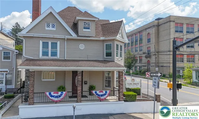 a front view of a house with outdoor space