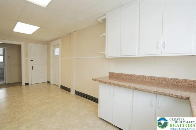 a room with a stove and a window