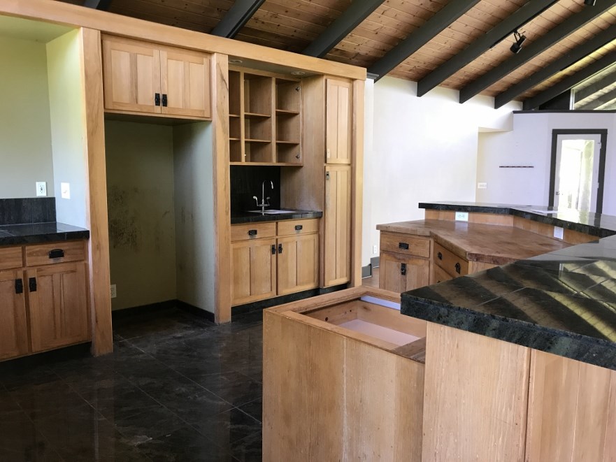 200 Awalau Road Haiku, HI 96708 - Photo 9 of 29 a kitchen with a refrigerator and a stove