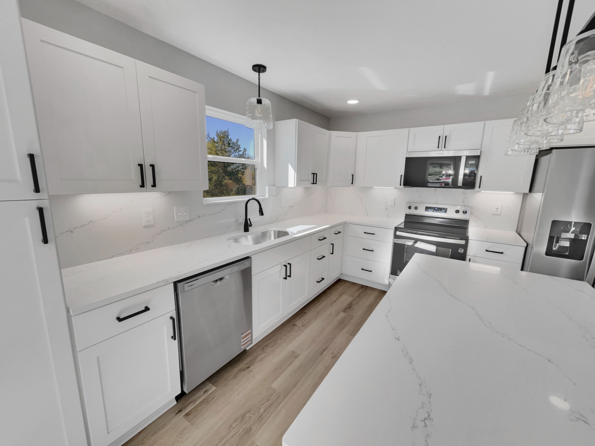 200 New Town Road Watertown, TN 37184 - Photo 2 of 13 a kitchen with granite countertop a sink and white cabinets