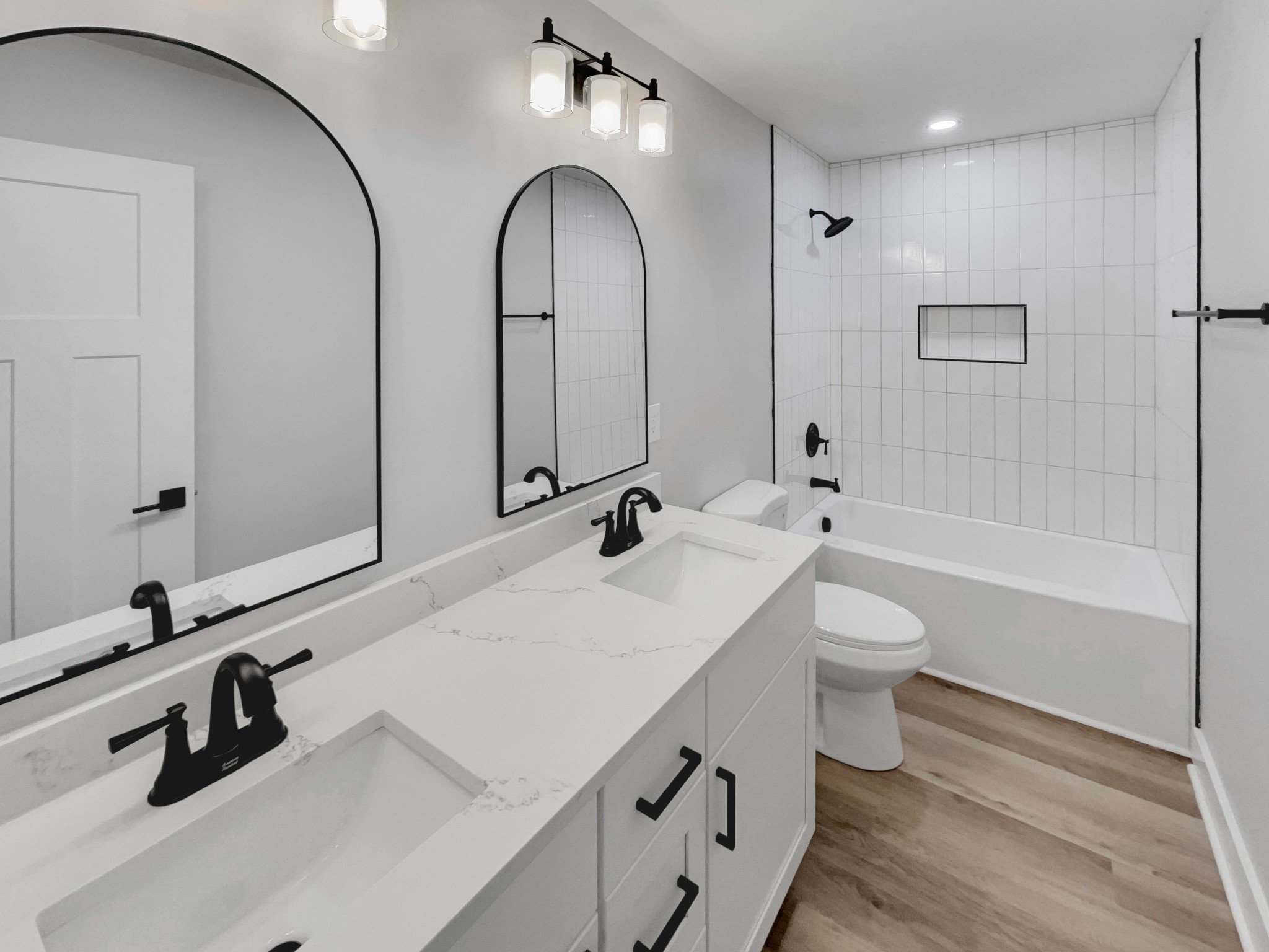 200 New Town Road Watertown, TN 37184 - Photo 5 of 13 a bathroom with a double vanity sink a toilet and a tub